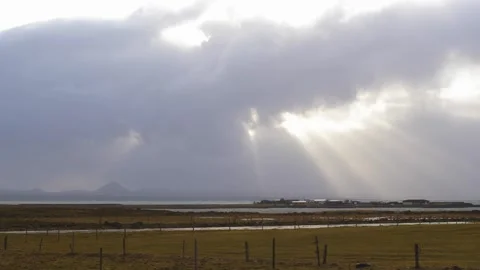 Crepuscular Rays and Mountains in Background, Windy Day, Iceland Stock Footage 257430498