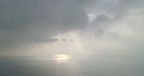 Crepuscular rays Through the Clouds Above the Open Sea Stock Footage 243890563