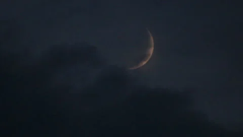 Crescent in clouds Stock Footage 116877592