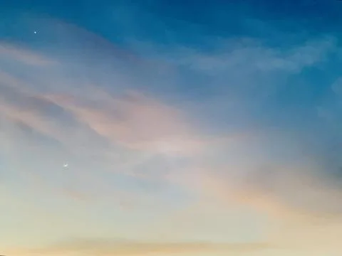 Crescent Moon and Star in Soft Evening Sky over Jakarta Indonesia Stock Photos