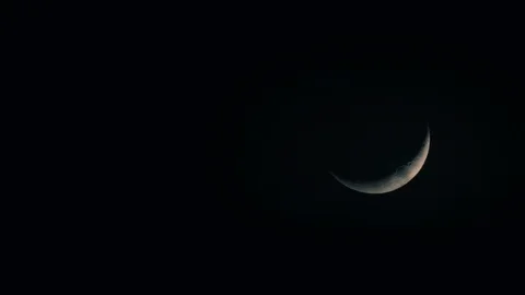 Crescent moon with clouds in the night sky Stock Footage 87731685