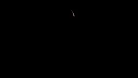 Crescent moon in the dark night sky over Shimen, New Taipei City, Taiwan Vídeo Stock 340897009