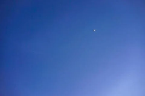 Crescent moon with empty blue sky copy space for banner or wallpaper backgrou Stock Photos
