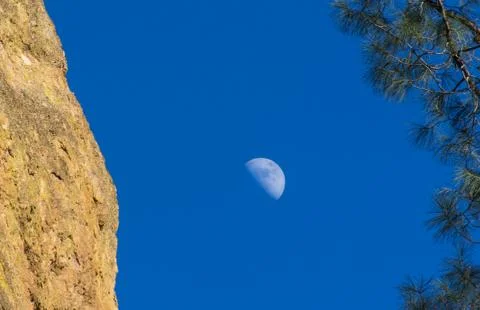 Crescent Moon with Mountain Backdrop Stock Photos