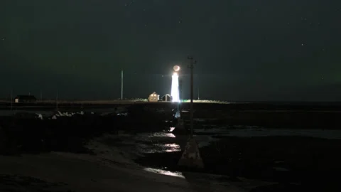 Crescent moon over Grotta lighthouse, Reykjavik Iceland close up Stock Footage 238480032