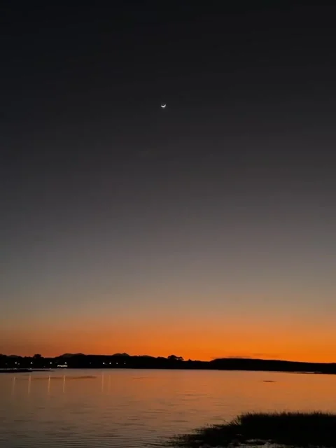 Crescent Moon Over Twilight Water Vídeos de archivo 341629598