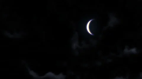 Crescent Moon, peeking out from the clouds 库存影片 35578100