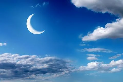 A crescent moon is shining above a cloudy sky in the midnight sky Ilustração Stock