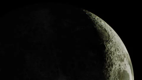 Crescent moon visible in the night sky over a dark background Stock Footage 343936983