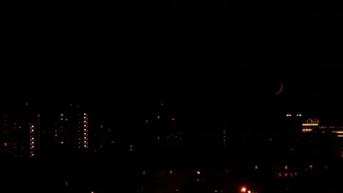 Crescent move down above town Stock Footage 155385045