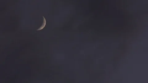 Crescent peach moon with clouds moving reveal Stock Footage 88962595