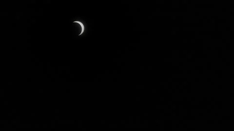 Crescent-shaped partial solar eclipse timelapse Stock Footage 135296835