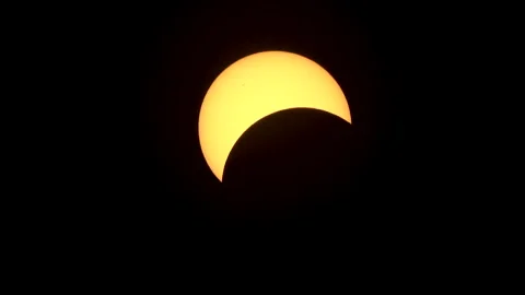 Crescent shaped sun during the partial phase of a solar eclipse. Stock Footage 272407047