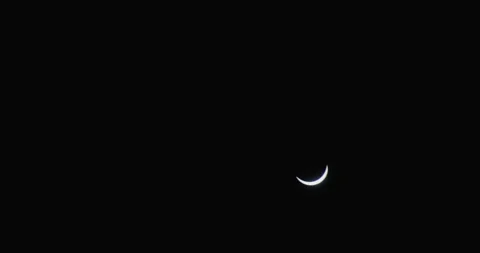 A crescent solar eclipse over Little Rock, Arkansas captured in the dark Stock Footage 276739521