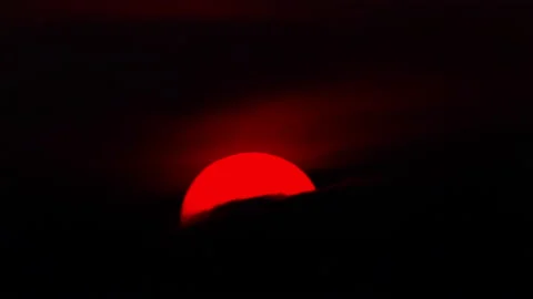 Crescent Sun during Sunset Stockbeeldmateriaal 238509550