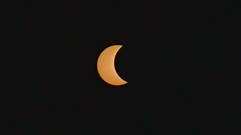 Crescent sun moving during a solar eclipse Stock Footage 342079837