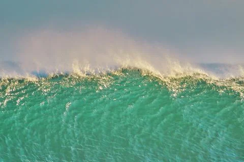 The crest of a breaking wave Stock Photos