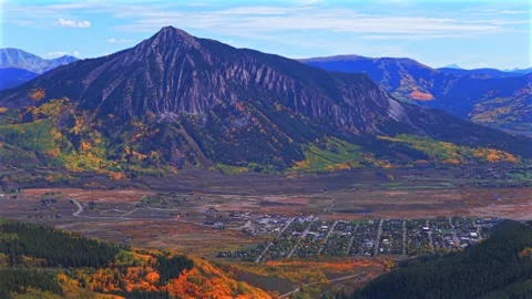 Crested Butte ski resort town drone aerial parallax circle left Mount Crested Stock Footage 323066430
