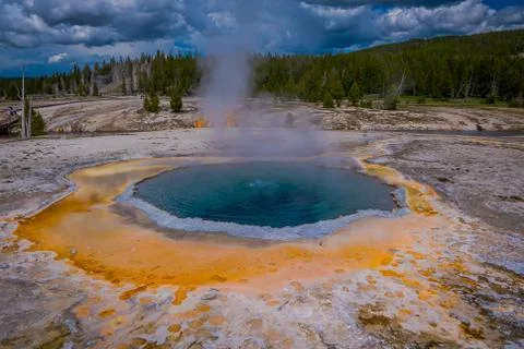Crested pool hot spring and orange microbial mat in the old faithful geyser Stock Photos