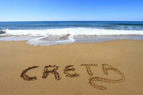 Creta written on sandy beach Stock Photos