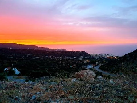 Crete mountains, beautiful evening sunset, view on village Stock Photos