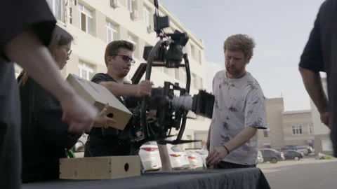 Crew assembles steadicam rig for opening test shots Stock Footage 306553760