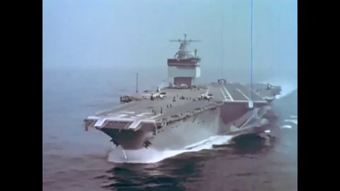 Crew on board the USS Enterprise during the 1960s wake up and prepare for a day Stock Footage 74701109