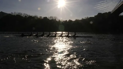 Crew boat on the Hudson with sun behind them Stock Footage 80620370