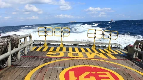 Crew boat sailing causing sea waves in the middle of the ocean Stock Footage 48084525