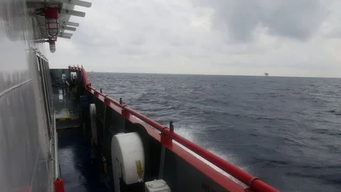 Crew boat sailing causing sea waves Stock Footage 71098143