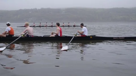A crew boat team rows across the river Stock Footage 80622253