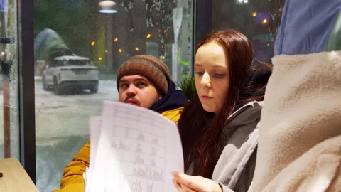 Crew cafeteria actively discusses script in service station Stock Footage 303061767