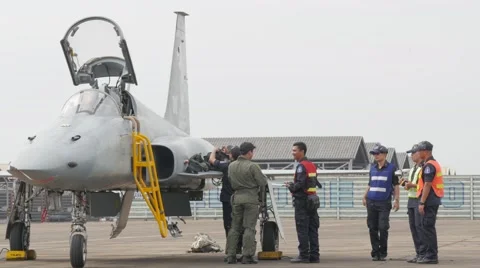 Crew checking fighter plane after landing,Ubon Ratchathani,Thailand Stock Footage 58891490