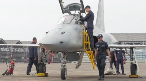 Crew checking plane and cockpit of fighter,Ubon Ratchathani,Thailand Stock Footage 58891382