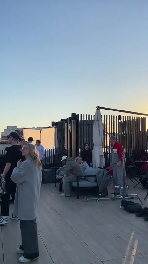 Crew collaborates with actors while adjusting interior decor Stock Footage 303060404