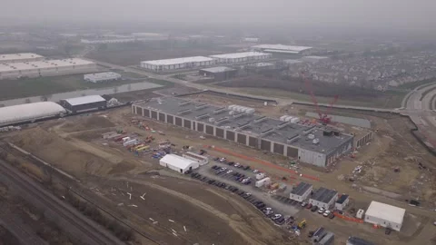 Crew constructing and building new data center for tech company drone Stock Footage 341598318
