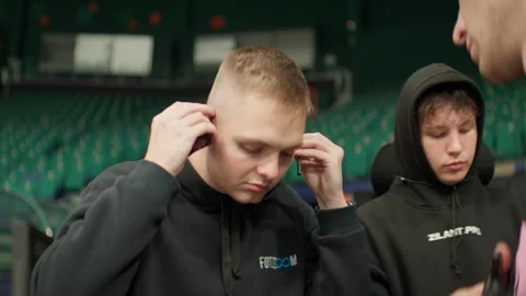 Crew deliberates technical details while director puts on headset Stock Footage 303277418