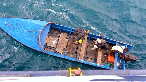 Crew get off the boat and get on the boat Stock Footage 219469424