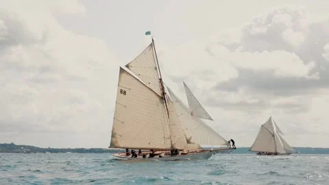 Crew hoisting a sail aboard a classic racing yacht during an offshore regatta. Stock-Footage 344230825