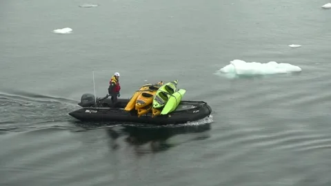 Crew Member Transporting Kayaks by Inflatable Boat in Gerlache Strait Antarctica Video stock 344548433