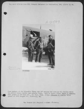 Crew members of the Liberator Patsy Ann II discuss the blow at the beaches... Stock Photos
