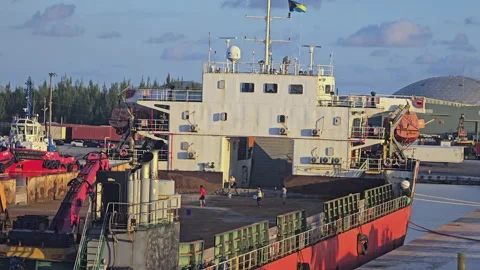 Crew members playing soccer on the deck of a docked cargo ship Stock Footage 340594795