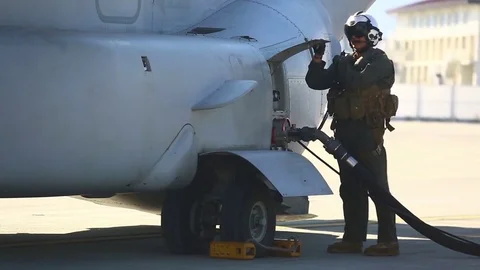 Crew members refuel MV - 22 aircraft while its engine running - 2017 Stock Footage 84952818