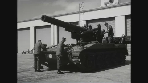 Crew members remove cover and check transmission oil level of M110 - 1964 Stock Footage 102209767