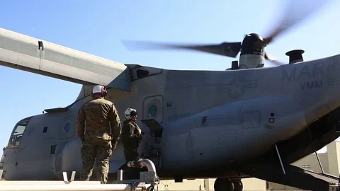 Crew members set the pit to refuel MV - 22 aircraft - 2017 Stock Footage 84952786