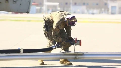 Crew members set the pit to refuel MV - 22 aircraft - 2017 Stock Footage 84952824
