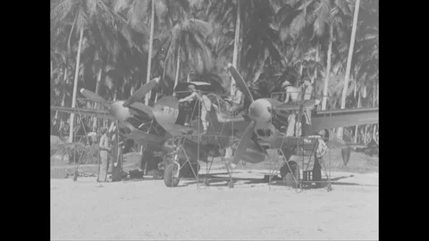 Crew members test the radio communication system of P-38 aircraft - 1944 Stock Footage 99786355