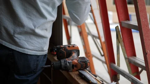 A crew of men construction workers framing and building a tiny house. Video stock 120755670