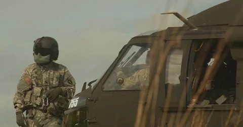 Crew outside Black Hawk Helicopter Video stock 84031846