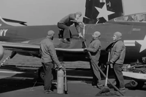 Crew refuel jet aircraft on the flight deck, jet fly in formation - 1951 Stock Footage 102874609